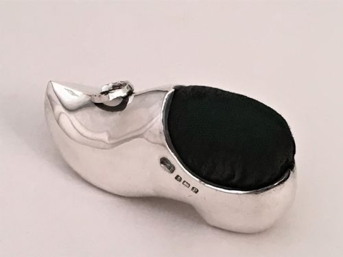 fig 1. A novelty silver clog/horseshoe pin cushion