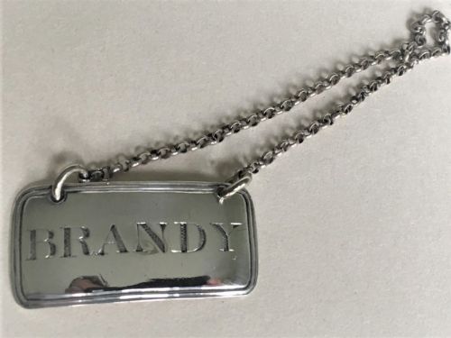 fig 1. A fine Georgian silver Brandy decanter label