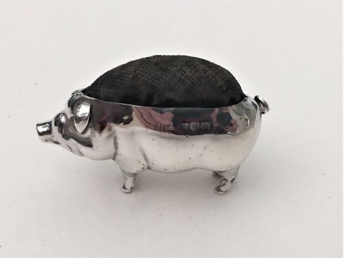 A Sought After Silver Pig Pin Cushion