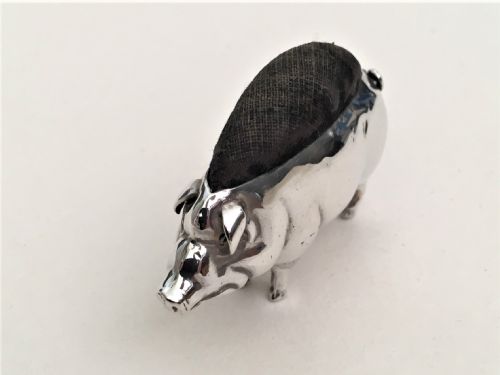 fig 1. A sought after silver pig pin cushion