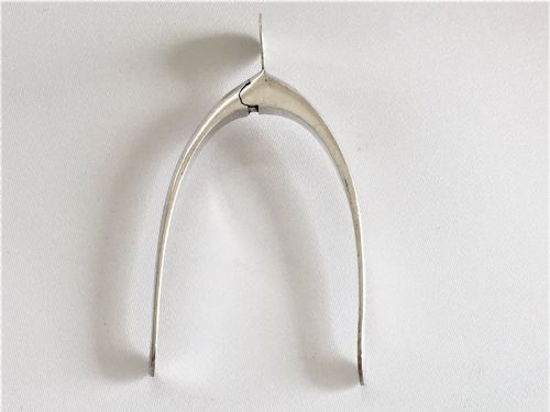 fig 1. A pair of novelty silver sprung wishbone tongs