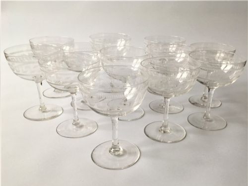 A Fine Set of 12 Greek Key Etched Champagne Bowls