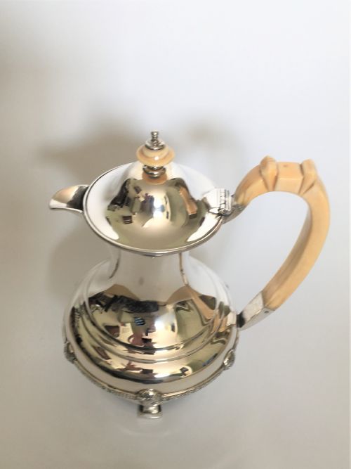 fig 1. A superb Arts & Crafts silver coffee pot/hot water jug