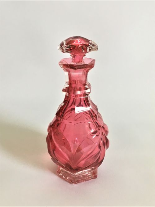 A Victorian Cranberry Gothic Cut Cologne Bottle