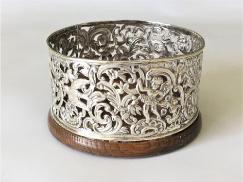 A Fabulous William Comyns Pierced Silver Wine Bottle Coaster
