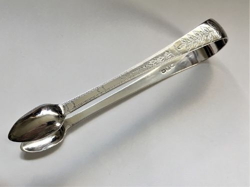 A Pair of Unusual Georgian Bright Cut Silver Tongs