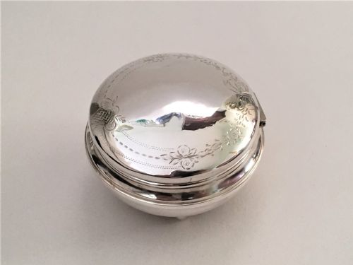 fig 1. A pretty ribbon & flower engraved silver trinket box
