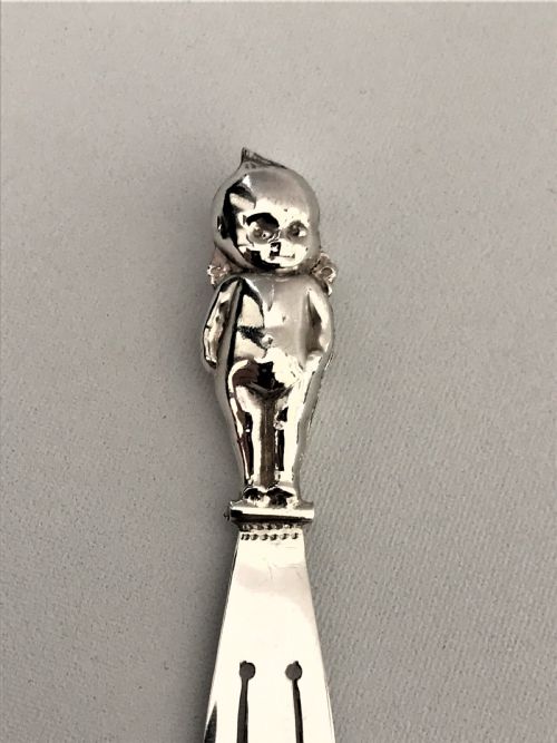 fig 1. A rare silver 'thumbs up' good luck bookmark