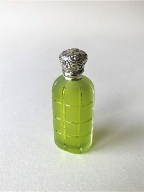 A Stunning Acid Green Silver Mounted Scent Bottle