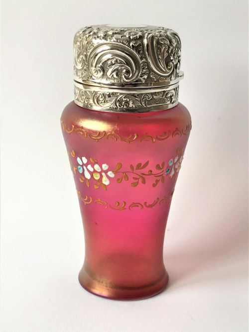 A Fabulous Silver Mounted Iridescent Glass Cologne Bottle