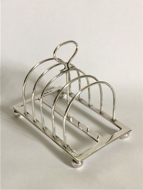 A Charming Four Slice Silver Toast Rack