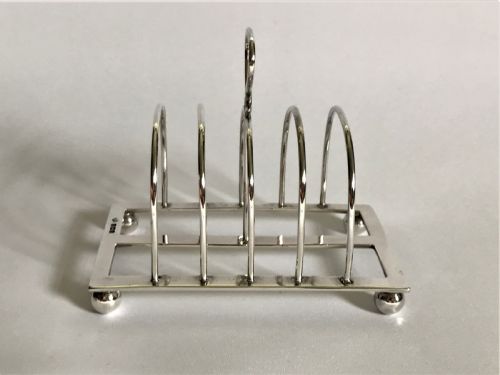 fig 1. A charming four slice silver toast rack