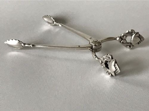 A Fine Pair of Acorn Pattern Georg Jensen Silver Sugar Nips