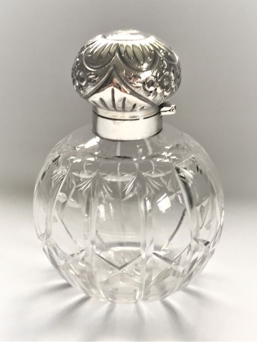 An Edwardian Silver Mounted Cologne Bottle