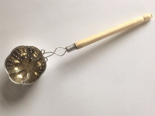 An Unusual Edwardian Silver 'Suspension' Tea Strainer