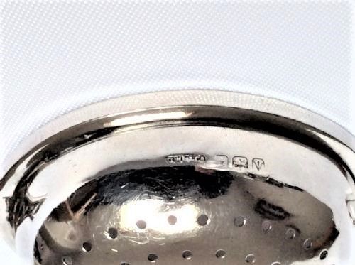 fig 1. A lovely Art Deco silver tea strainer