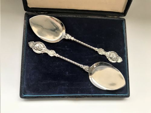 fig 1. A superb pair of boxed cast silver preserve spoons