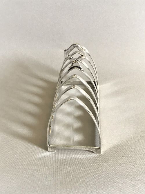 fig 1. A Gothic design six slice silver toast rack 