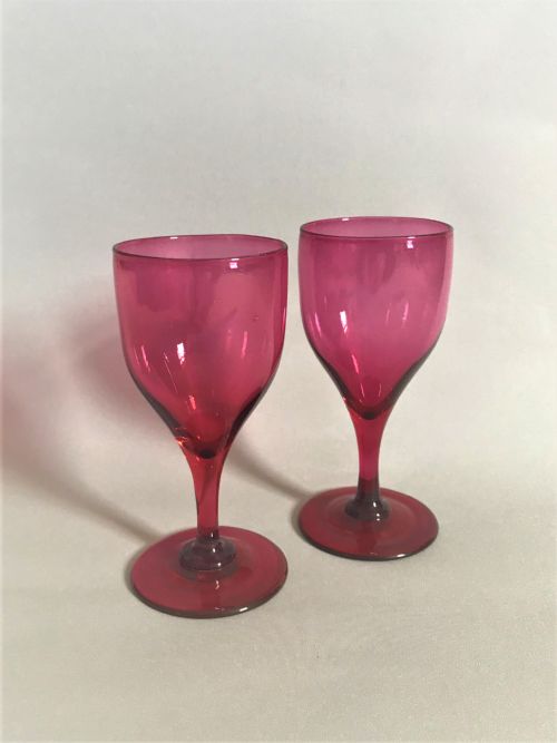 A Rare Pair of Victorian Cranberry Wine Glasses