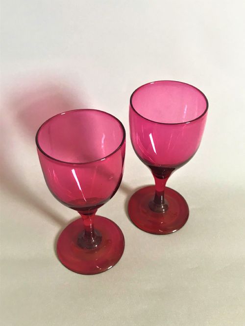 fig 1. A rare pair of Victorian cranberry wine glasses