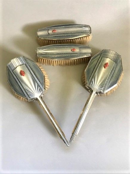 A Superb Set of Four Art Deco Silver & Enamel Brushes