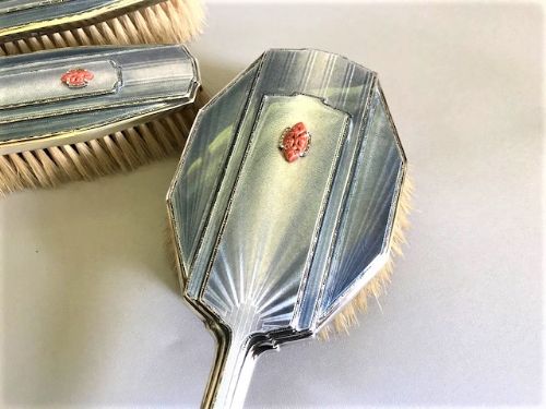 fig 1. A superb set of four Art Deco silver & enamel brushes