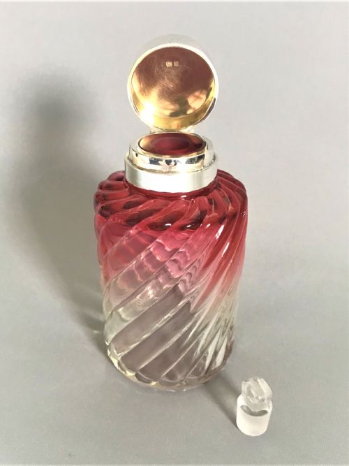 fig 1. A silver mounted & cranberry glass cologne bottle