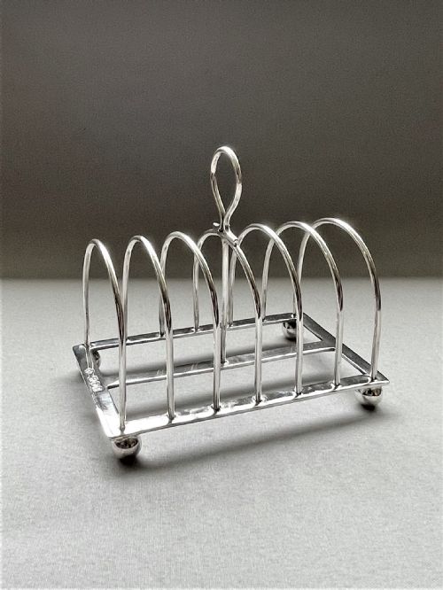 fig 1. A Georgian revival six slice silver toast rack