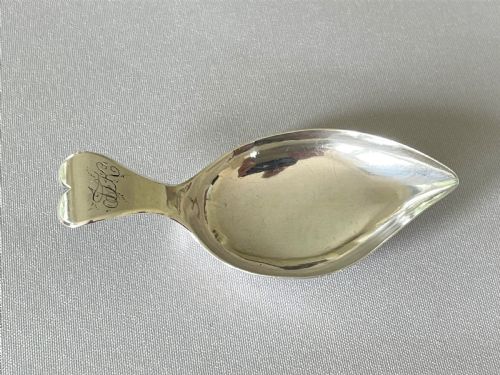 A Georgian Silver Leaf Caddy Spoon with Heart Handle