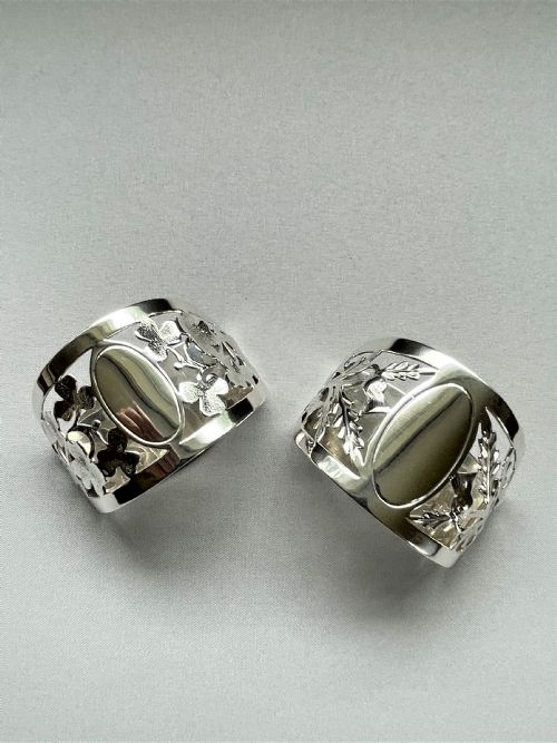 fig 1. A superior pair of Scottish/Irish themed silver napkin rings