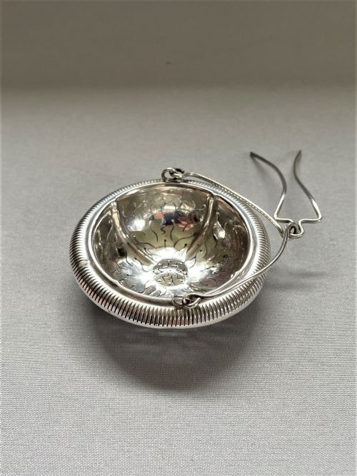 A Charming French Silver Suspension Tea Strainer