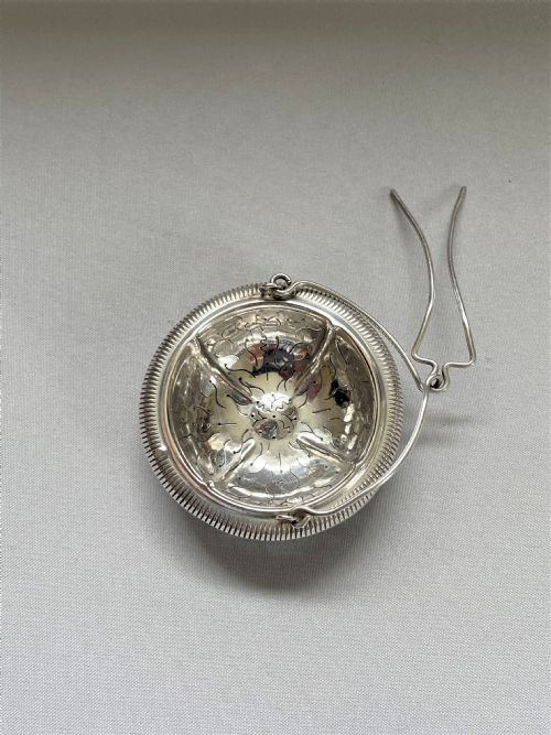 fig 1. A charming French silver suspension tea strainer