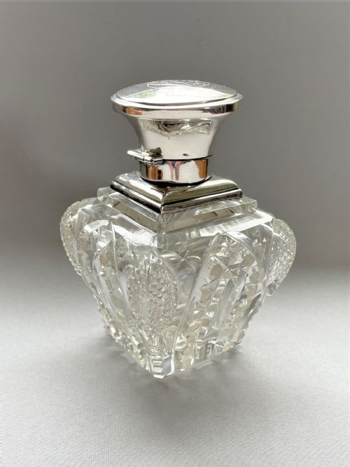A Stunning Silver Mounted Cut Glass Table Cologne Bottle