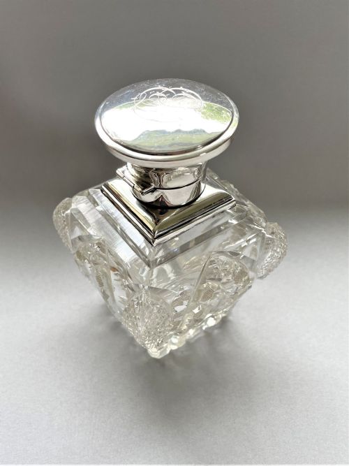 fig 1. A stunning silver mounted cut glass table cologne bottle