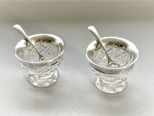 A Charming Silver Mounted Salt & Pepper Duo & Spoons