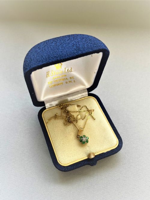 fig 1. A pretty gold mounted emerald and diamond pendant