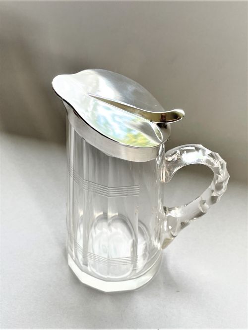 fig 1. A desirable silver mounted cut glass Whisky companion