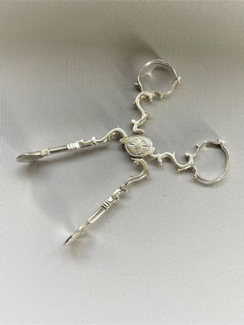 fig 1. A pair of 18th Century Irish silver tea tongs