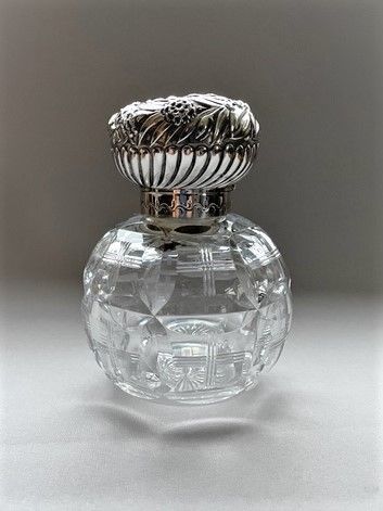 A Large Victorian Silver Mounted Cologne Bottle