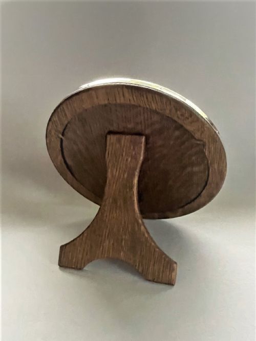 fig 1. A large circular silver photo frame