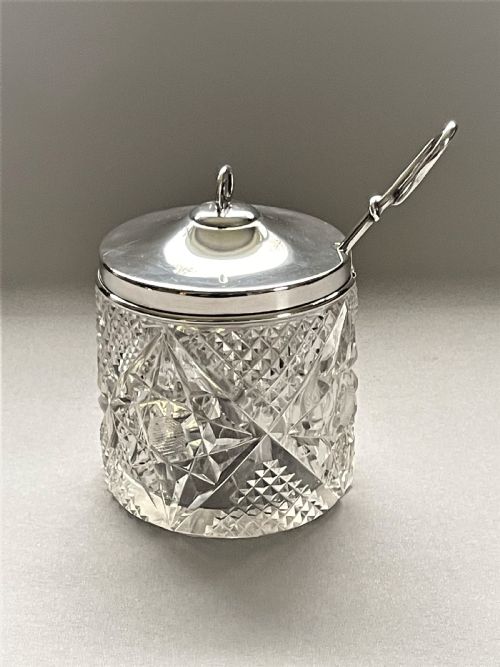 An Edwardian Silver Mounted Cut Glass Preserve Jar & Spoon