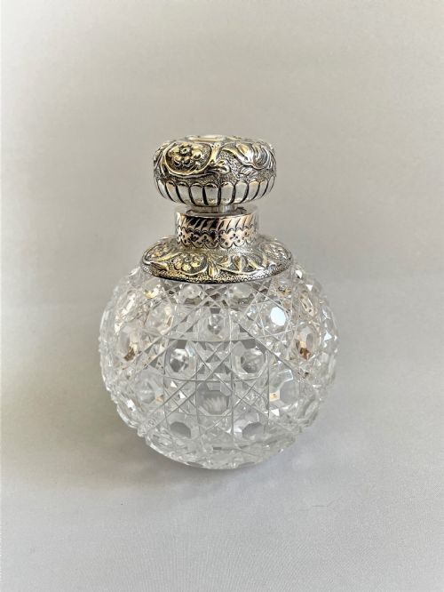 A Fabulous Victorian Silver Mounted Cologne Bottle