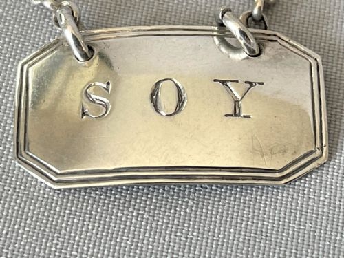 fig 1. A desirable silver 'Soy' bottle ticket