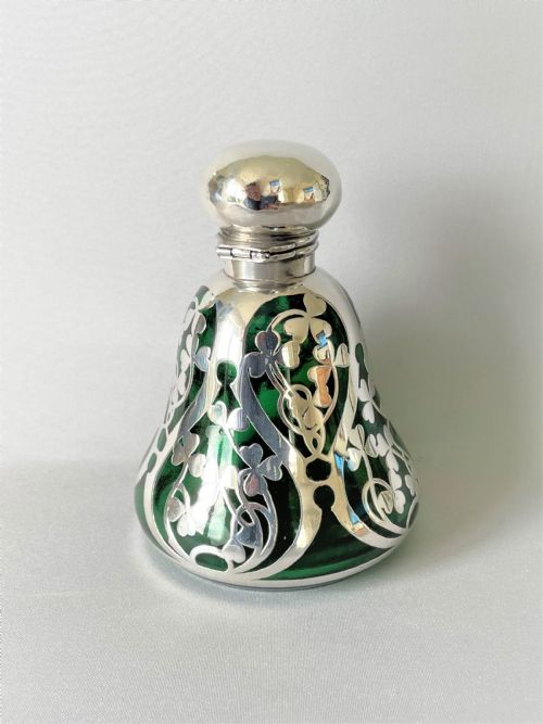 A Stunning Art Nouveau Silver Mounted Cologne Bottle