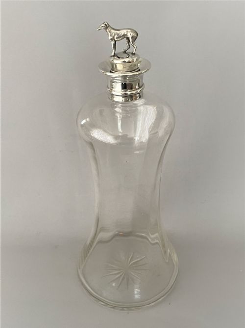 fig 1. A rare Victorian silver mounted decanter with greyhound stopper