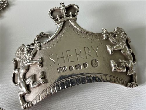 fig 2. A spectacular set of 3 Leslie Gorden Durbin silver Coronation decanter labels