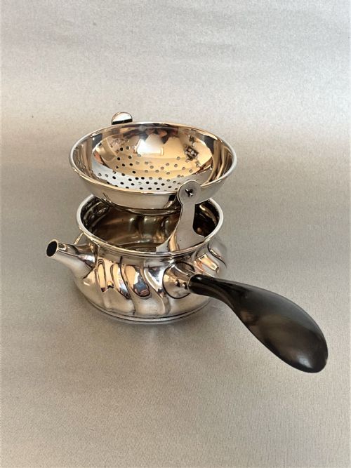 fig 1. A superb Danish silver tea strainer & cup