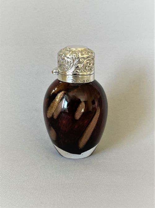 An Unusual Victorian Silver Mounted Scent Bottle