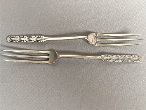A Rare Pair of Liberty & Co. Silver Pickle/sweetmeat Forks