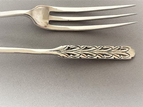 fig 1. A rare pair of Liberty & Co. silver pickle/sweetmeat forks